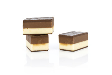 Group of three whole mellow two coloured nougat piece isolated on white background