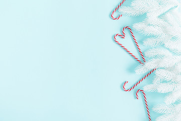 Christmas modern composition. Fir white branches. Xmas decorations on pastel blue background. Christmas, New Year, winter concept. Flat lay, top view, copy space