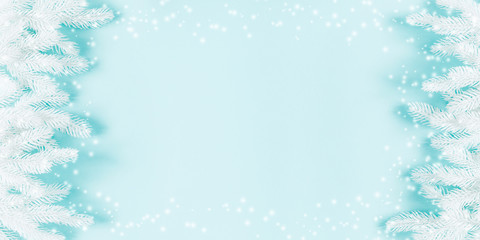Christmas modern composition. Fir white branches. Xmas decorations on pastel blue background. Christmas, New Year, winter concept. Flat lay, top view, copy space, banner