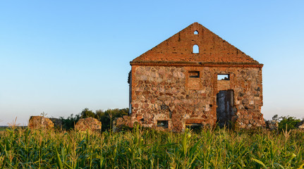 The building of the first manufactory stands on the outskirts of the village in the field.The building is red brick and stone. Ancient building in Belarus. Sights of Belarus.Sights of the Brest region