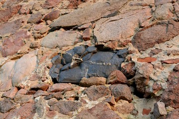 The building of the first manufactory stands on the outskirts of the village in the field.The building is red brick and stone. Ancient building in Belarus. Sights of Belarus.Sights of the Brest region