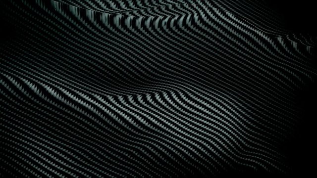 Carbon waving flag background video waving in wind. Realistic Black Kevlar background. Carbon Flag Looping 1080p Full HD 1920X1080 footage. Carbon color sign of modern, graphene structure, dark carbon