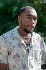 male model with pursed lips floral shirt