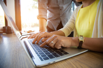 Team Business are searching for information on their competitors with mobile phones to plan their future investments.project concept