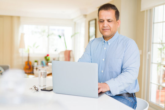 Middle age man using computer laptop