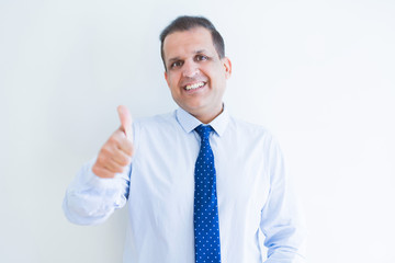 Middle age man doing postive gesture with thumbs up smiling to the camera