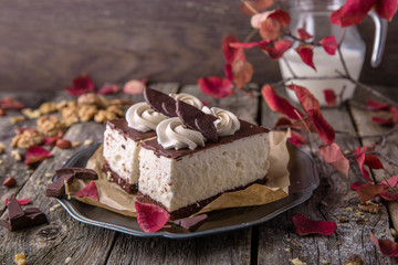 Sliced meringue cake. A piece of dessert on wooden boards.