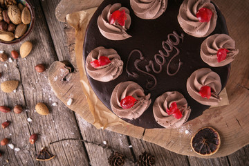 Chocolate caramel cake prague. Beautiful still life on wooden boards