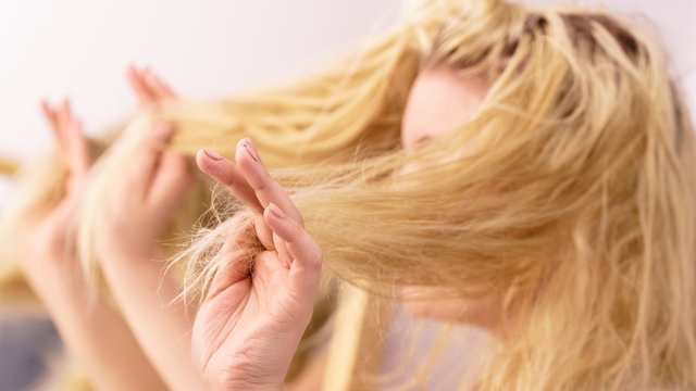 Woman having blonde split ends hair