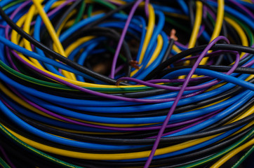 Many kinds of wires coiled into a pile