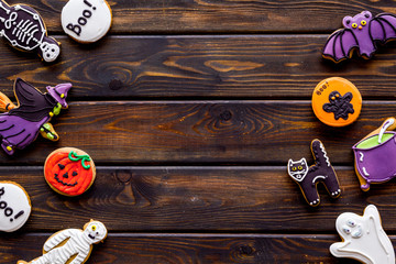 Halloween decorations frame on wooden background top view copyspace