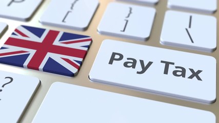 PAY TAX text and flag of the United Kingdom on the buttons on the computer keyboard. Taxation related conceptual 3D animation