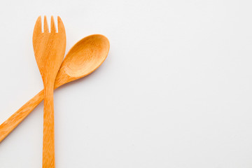wooden spoon and fork isolated on white background