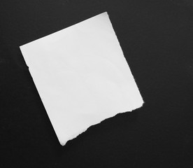 Ripped paper on black background