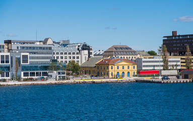 Beautiful seascape norwegian coastline, coast of Kristiansand with buildings, Scandinavia, Norway. July 2019