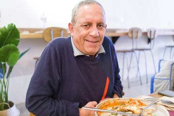 Middle age man wearing sweater standing 