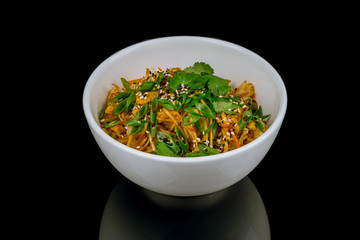 wok with shrimp on black glass with reflection