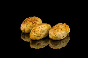 chicken cutlets on black glass with reflection