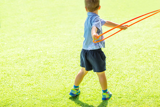 little boy playing with hula hoop - filter color effect