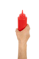 hand holding plastic ketchup box