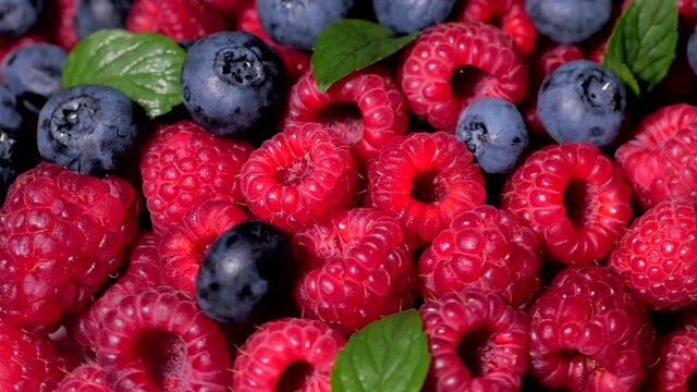 Close Up Rotation Loopable Raspberry. Fresh, Juicy Raspberry Background, Ripe. Macro Red Raspberries Fruit. Fresh Raspberry Fruits As Food Dackground. Healthy Food Organic Nutrition.