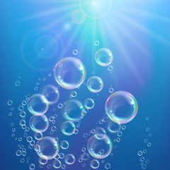 Realistic transparent floating soap bubbles with rainbow reflection. Design element for advertising booklet, flyer or poster