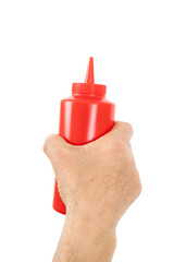 hand holding plastic ketchup box