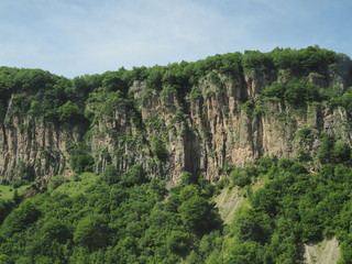 Fototapeta premium beautiful landscape with views of the rocky mountains and mountains covered with green grass and shrubs