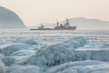 Two small ships stuck in arctic ice ice. Ships on a raid in the Arctic ice © alexhitrov