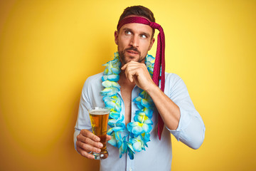 Hangover business man drunk and crazy for hangover wearing tie on head drinking beer serious face...