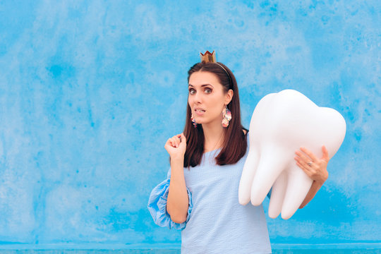 Woman In Tooth Fairy Costume Holding Big Molar