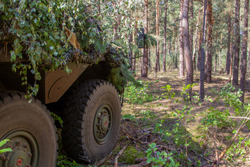 Fototapeta na wymiar Armoured personnel carrier from german army stands in a military training area