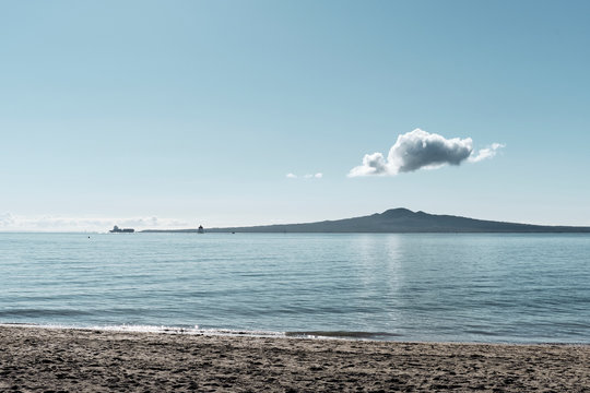Rangitoto island Scanic Reserve from Auckland's Mission bay beach in mid-day time
