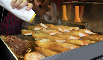 chef preparing  kokorech bread on the street in restaurant
