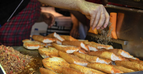 chef preparing  kokorech bread on the street in restaurant