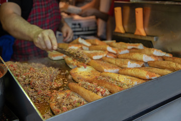 chef preparing  kokorech bread on the street in restaurant
