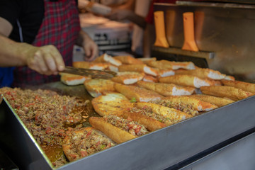 chef preparing  kokorech bread on the street in restaurant