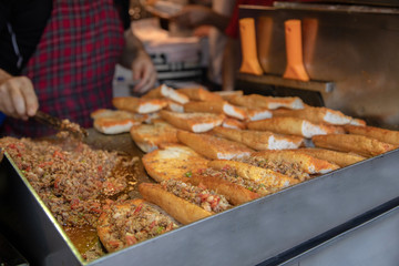 chef preparing  kokorech bread on the street in restaurant