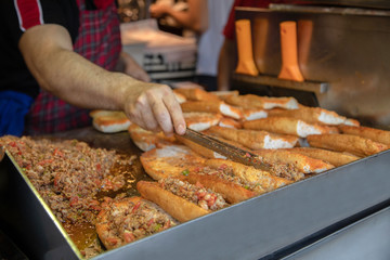 chef preparing  kokorech bread on the street in restaurant