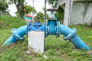 Fototapeta na wymiar A pump station delivers water for agricultural watering, Water pumping station. Valve faucet and pumps