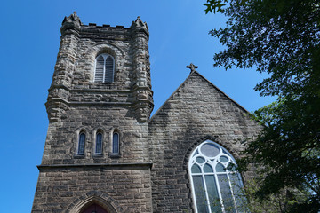 Fototapeta na wymiar Old stone church with Celtic Cross