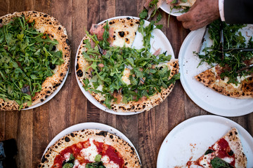 pizza dinner with salad with tomatoes and cheese