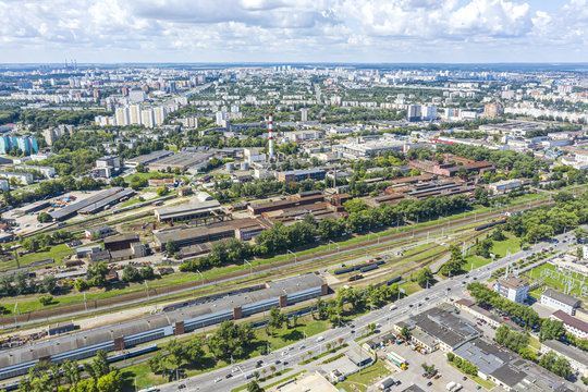 aerial panoramic image of city industrial zone. top view of roofs of warehouses