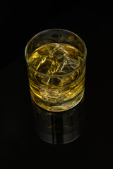 Whiskey in the rocks, Glass of whiskey with ice cubes