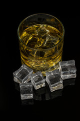 Whiskey in the rocks, Glass of whiskey with ice cubes