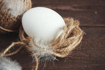 White chicken eggs and shell on a dark wooden background.