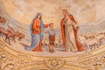 TAORMINA, ITALY - APRIL 9, 2018: The symbolic fresco of boy St. Don Bosco with the Virgin Mary and Jesus from cupola of  church Chiesa di San Guseppe from 20. cent.