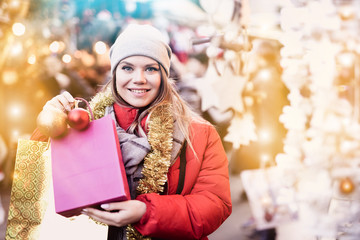 Happy woman on outdoor Christmas market