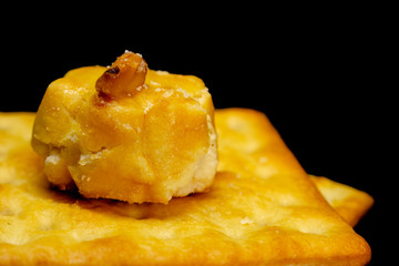 Cracker cookies on dark background.