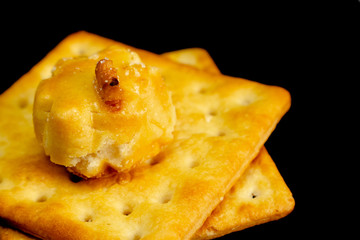 Cracker cookies on dark background.